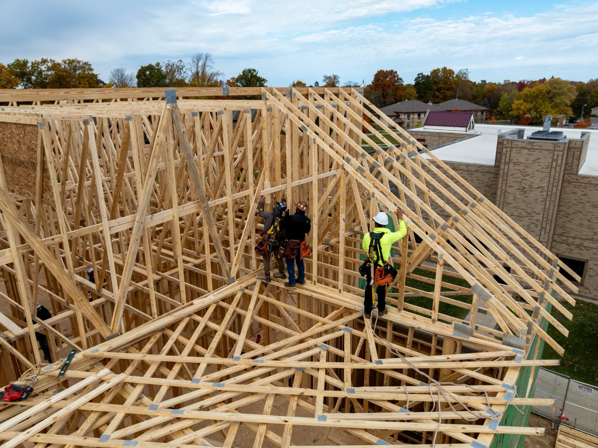 Installing side root trusses on a college building.
