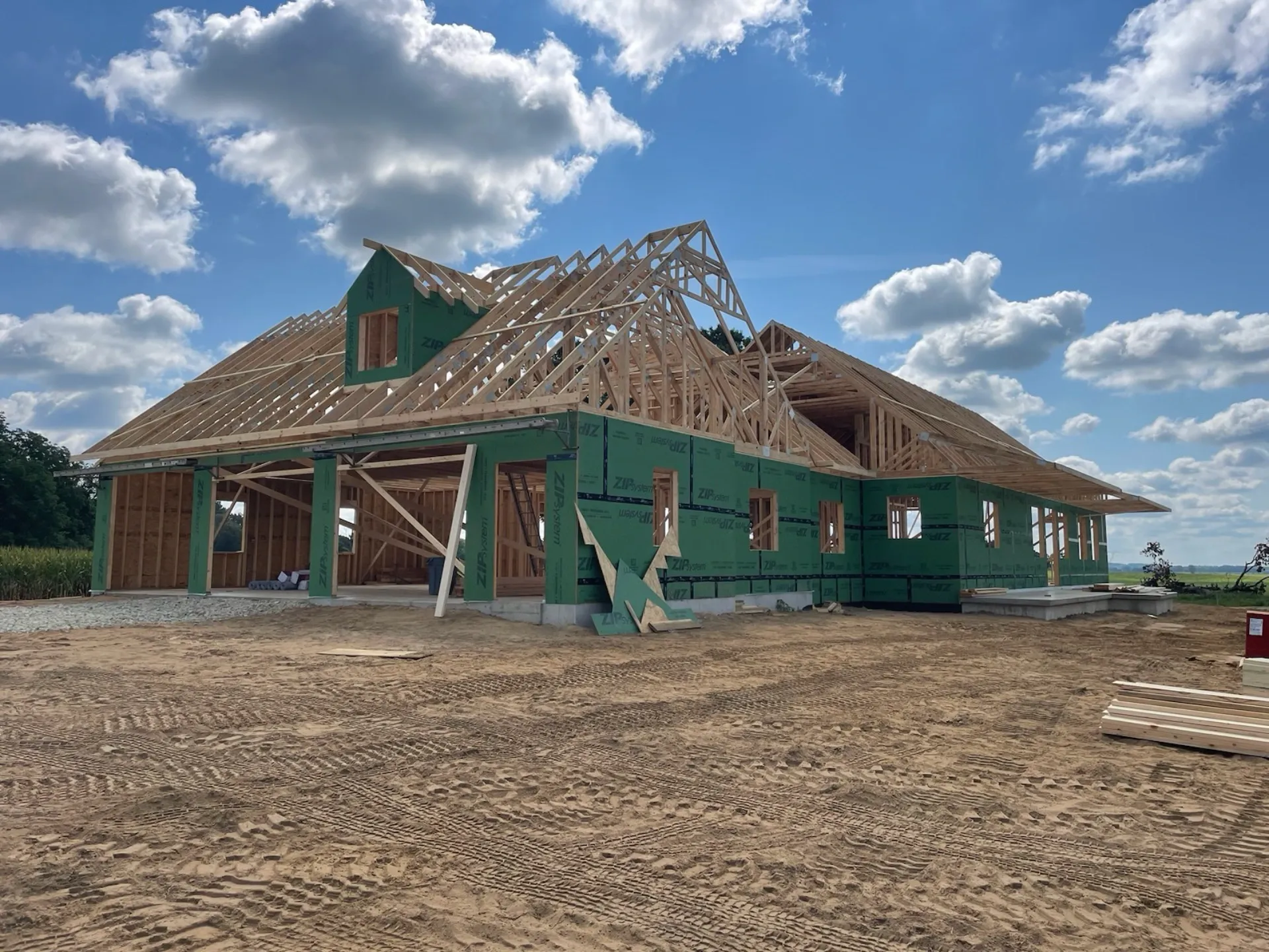 Residential home with installed roof trusses. Ready for plywood.