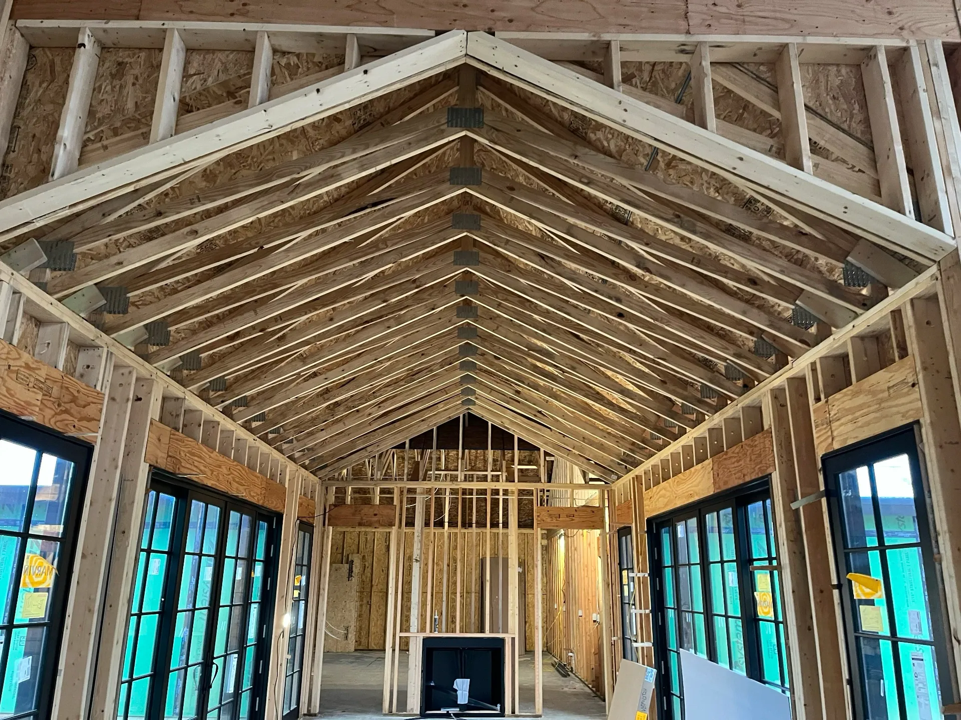 Roof trusses inside a hallway once the roof is put on.