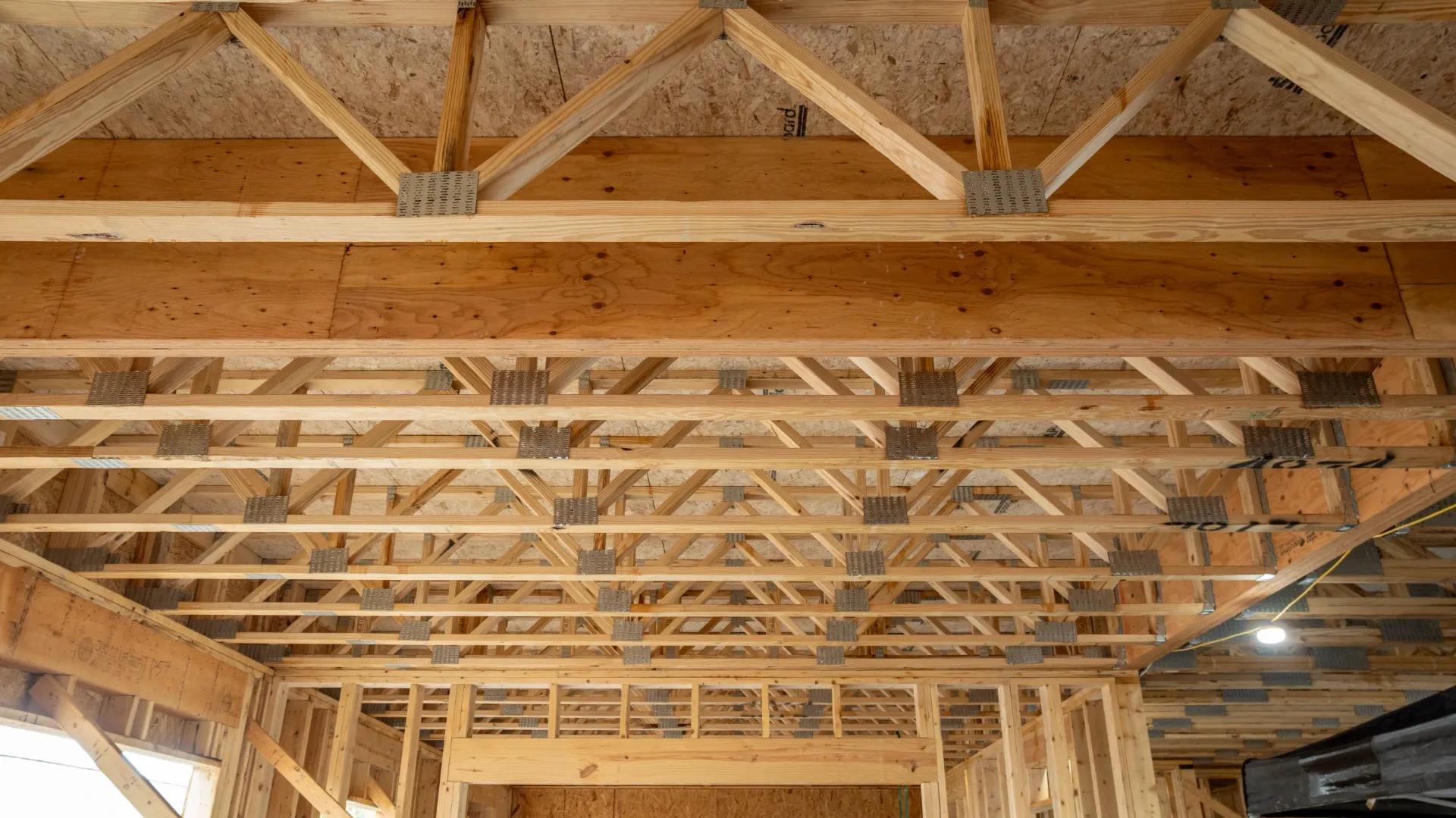 Underneath floor truss with exposed trusses.